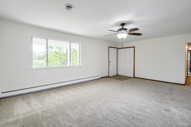 2680 N Lake George Rd, Metamora, MI 48455 - empty room featuring a baseboard heating unit, carpet floors, ceiling fan, and baseboards