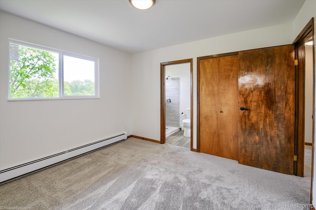 2680 N Lake George Rd, Metamora, MI 48455 - unfurnished bedroom featuring a baseboard radiator, carpet floors, ensuite bathroom, and baseboards