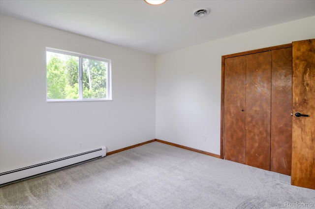 2680 N Lake George Rd, Metamora, MI 48455 - unfurnished bedroom with a baseboard radiator, carpet, a closet, and baseboards