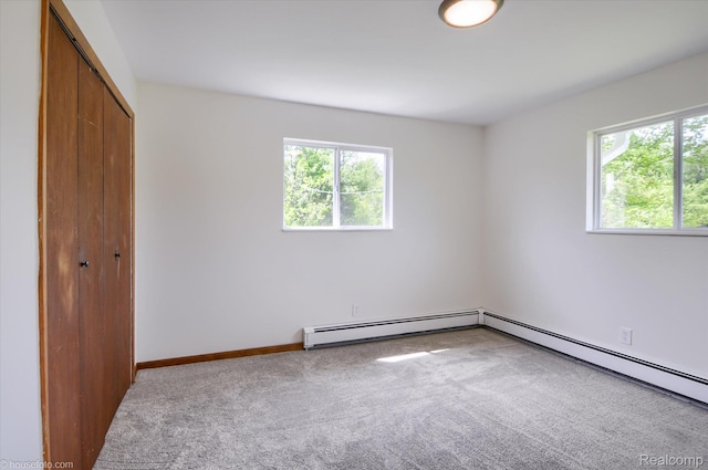 2680 N Lake George Rd, Metamora, MI 48455 - unfurnished bedroom featuring carpet flooring, multiple windows, baseboard heating, and a closet