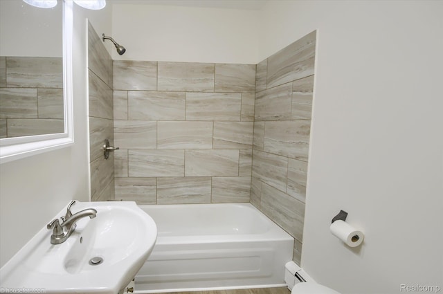 2680 N Lake George Rd, Metamora, MI 48455 - bathroom with a sink, bathtub / shower combination, and a baseboard heating unit