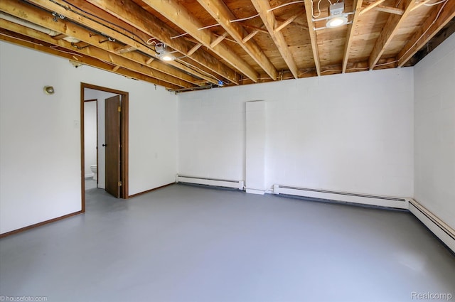 2680 N Lake George Rd, Metamora, MI 48455 - basement featuring a baseboard radiator and concrete block wall