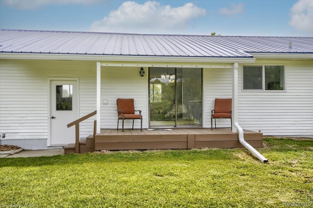 2680 N Lake George Rd, Metamora, MI 48455 - rear view of house with a lawn, metal roof, and a deck