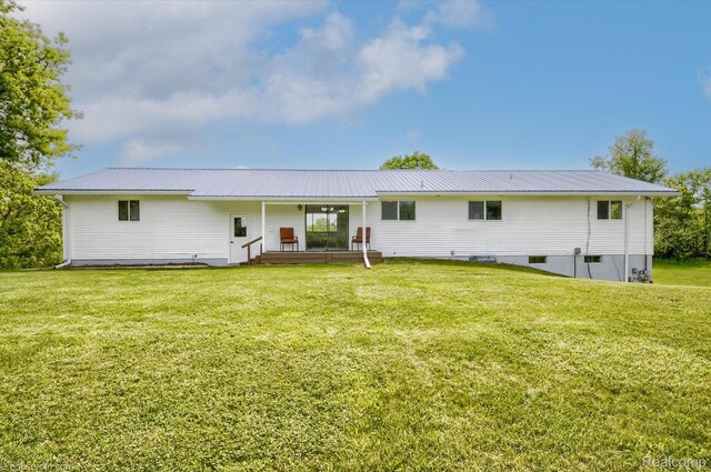 2680 N Lake George Rd, Metamora, MI 48455 - rear view of property with a yard and metal roof