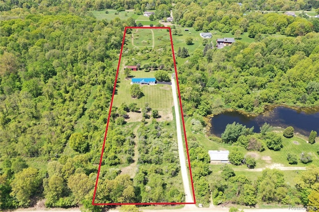 2680 N Lake George Rd, Metamora, MI 48455 - view of property location featuring property parcel outlined, a heavily wooded area, and a nearby body of water