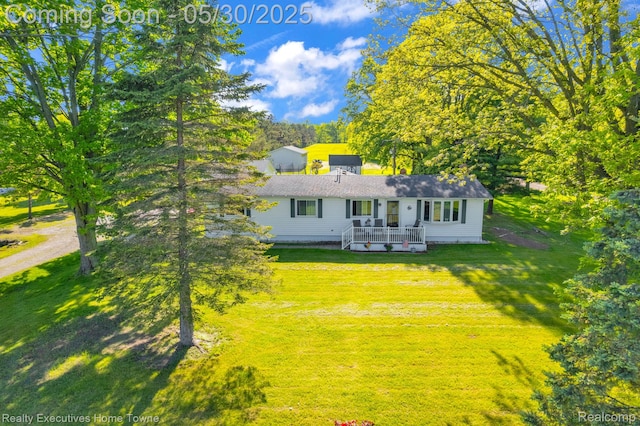 3889 Wadhams Rd, Clyde, MI 48049 - view of front of home featuring a front lawn and a deck