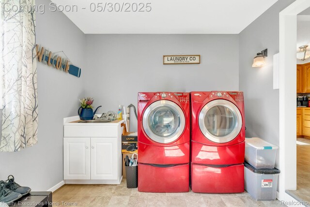 3889 Wadhams Rd, Clyde, MI 48049 - washroom featuring washer and clothes dryer and cabinet space