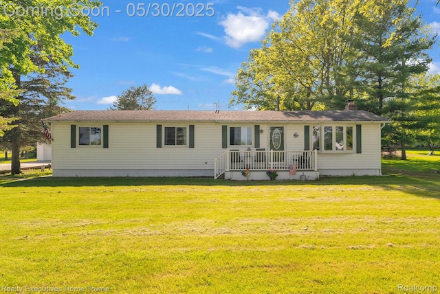 3889 Wadhams Rd, Clyde, MI 48049 - view of front of property featuring a front lawn and a chimney