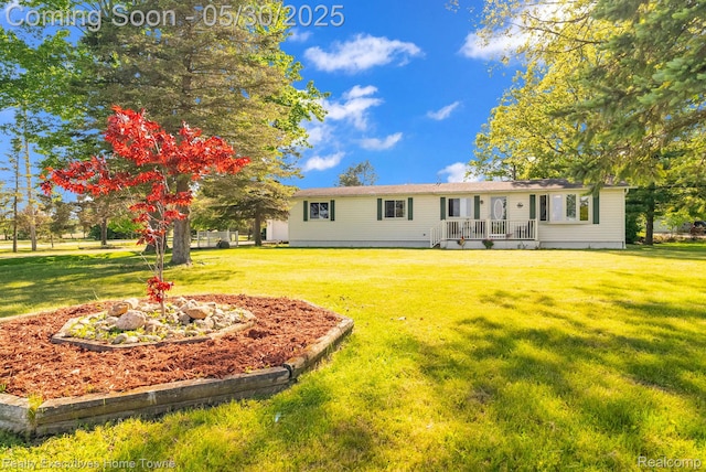 3889 Wadhams Rd, Clyde, MI 48049 - rear view of property featuring a lawn and a deck