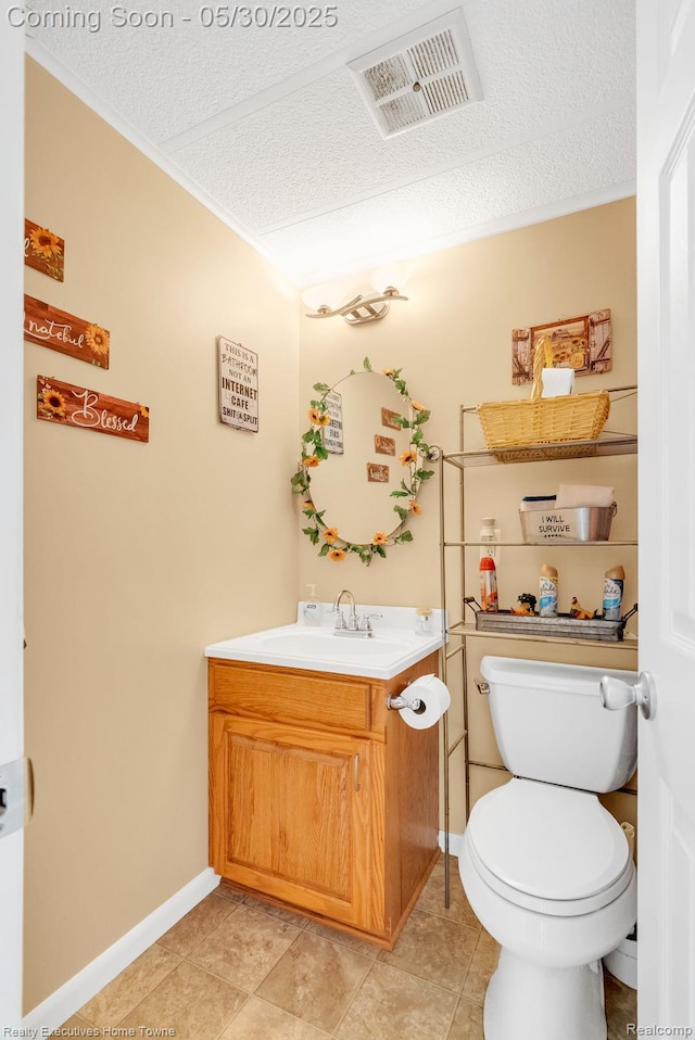 3889 Wadhams Rd, Clyde, MI 48049 - bathroom featuring a textured ceiling, vanity, toilet, ornamental molding, and baseboards