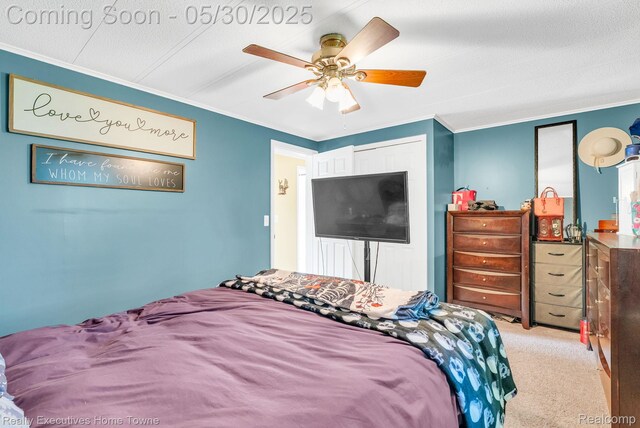 3889 Wadhams Rd, Clyde, MI 48049 - bedroom with crown molding, light carpet, and a ceiling fan