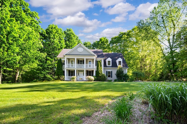 1796 Stockbridge Path, Saint Joseph, MI 49085 - neoclassical home featuring a balcony, covered porch, and a front lawn