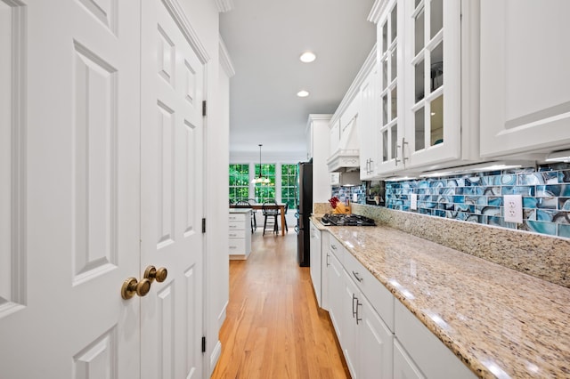 1796 Stockbridge Path, Saint Joseph, MI 49085 - kitchen with freestanding refrigerator, white cabinetry, light wood-style flooring, decorative backsplash, and recessed lighting