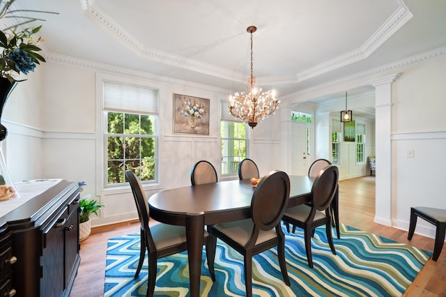 1796 Stockbridge Path, Saint Joseph, MI 49085 - dining space with a chandelier, light wood-style floors, a decorative wall, ornamental molding, and wainscoting