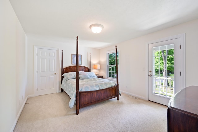1796 Stockbridge Path, Saint Joseph, MI 49085 - bedroom featuring access to outside, light colored carpet, and baseboards