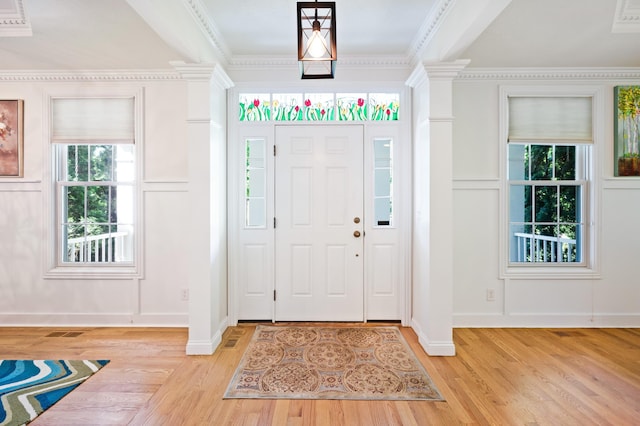 1796 Stockbridge Path, Saint Joseph, MI 49085 - foyer featuring a decorative wall, light wood-style flooring, decorative columns, and crown molding