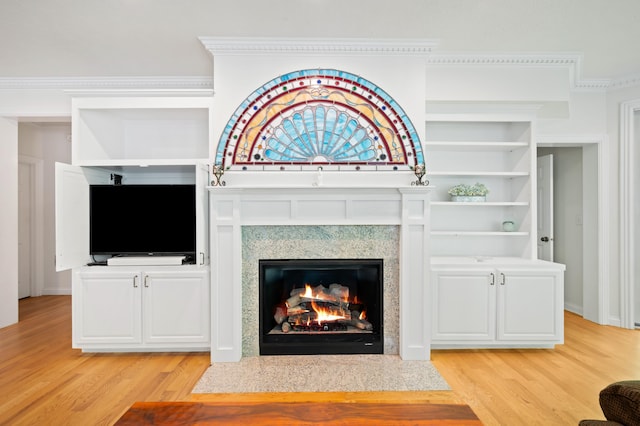 1796 Stockbridge Path, Saint Joseph, MI 49085 - unfurnished living room featuring light wood finished floors, a fireplace with flush hearth, and ornamental molding