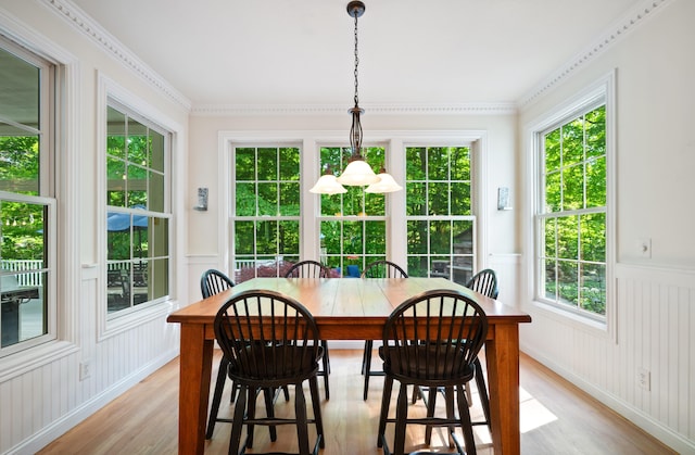 1796 Stockbridge Path, Saint Joseph, MI 49085 - dining space with light wood-style flooring, wainscoting, and a decorative wall