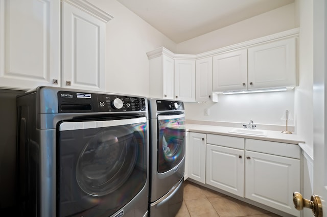 1796 Stockbridge Path, Saint Joseph, MI 49085 - laundry room with washer and clothes dryer, light tile patterned floors, and cabinet space