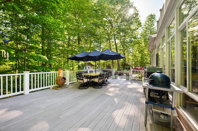 1796 Stockbridge Path, Saint Joseph, MI 49085 - wooden deck featuring outdoor dining area and view of wooded area