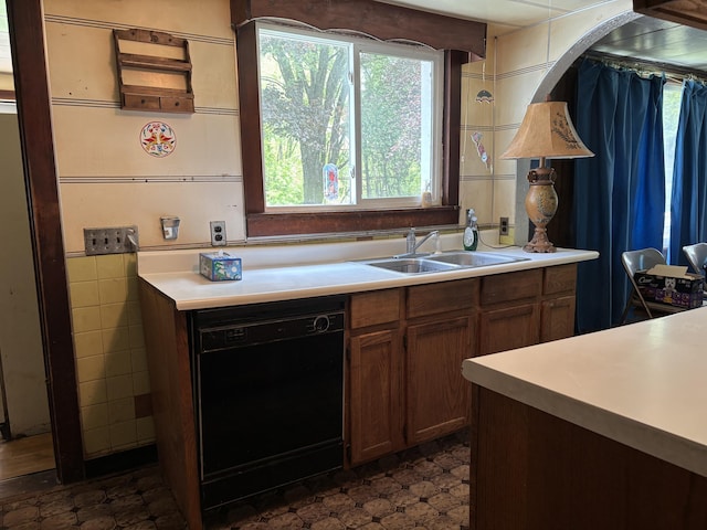 28131 66th St, Bangor, MI 49013 - kitchen featuring black dishwasher, light countertops, plenty of natural light, and a sink
