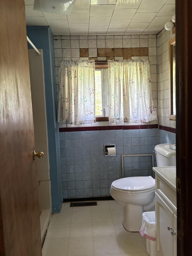 28131 66th St, Bangor, MI 49013 - bathroom featuring vanity, toilet, a shower, and tile walls