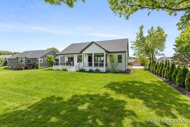 1509 Ponstein Dr, Hudsonville, MI 49426 - back of property with a yard and covered porch