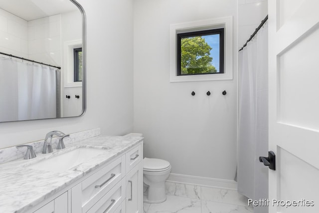 1509 Ponstein Dr, Hudsonville, MI 49426 - bathroom with vanity, marble finish flooring, toilet, baseboards, and a shower with curtain