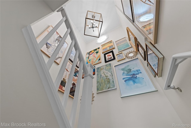 6863 Brightwood Ct, Waterford, MI 48327 - living room featuring a chandelier, a high ceiling, and stairway
