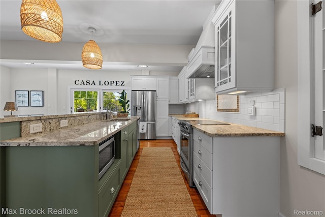 6863 Brightwood Ct, Waterford, MI 48327 - kitchen with green cabinetry, appliances with stainless steel finishes, a sink, tasteful backsplash, and dark wood-style floors