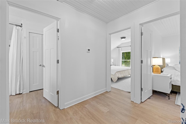 6863 Brightwood Ct, Waterford, MI 48327 - corridor featuring light wood-style flooring and baseboards