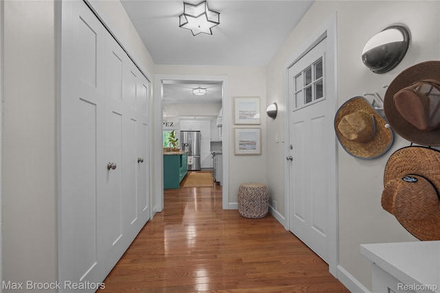 6863 Brightwood Ct, Waterford, MI 48327 - corridor featuring wood finished floors and baseboards