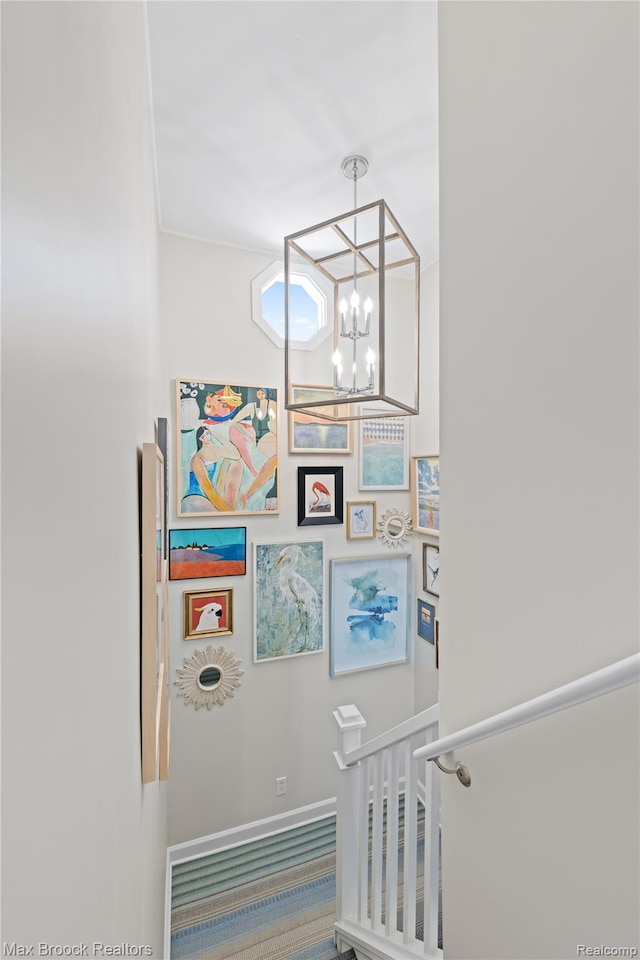 6863 Brightwood Ct, Waterford, MI 48327 - stairway with a chandelier, baseboards, and carpet floors