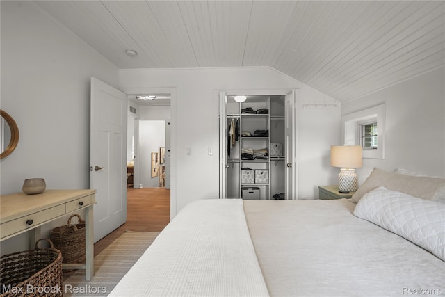 6863 Brightwood Ct, Waterford, MI 48327 - bedroom featuring wooden ceiling, lofted ceiling, a spacious closet, a closet, and wood finished floors