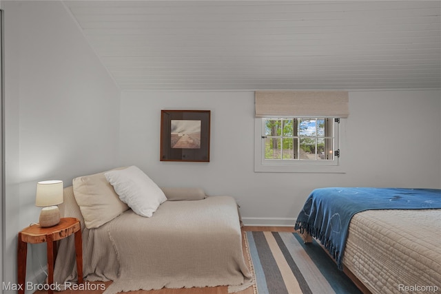 6863 Brightwood Ct, Waterford, MI 48327 - bedroom featuring wood finished floors, baseboards, and vaulted ceiling