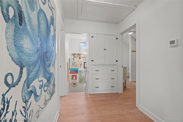 6863 Brightwood Ct, Waterford, MI 48327 - hallway featuring attic access, light wood-style flooring, and baseboards