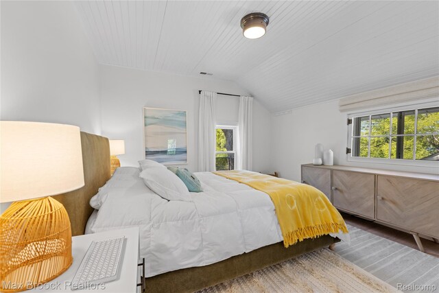 6863 Brightwood Ct, Waterford, MI 48327 - bedroom with vaulted ceiling and wood finished floors