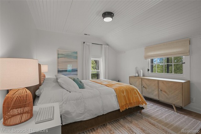 6863 Brightwood Ct, Waterford, MI 48327 - bedroom with lofted ceiling, wood finished floors, and wooden ceiling
