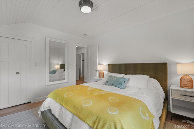 6863 Brightwood Ct, Waterford, MI 48327 - bedroom with wood finished floors, wood ceiling, vaulted ceiling, and baseboards