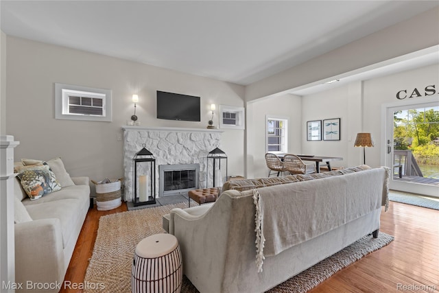 6863 Brightwood Ct, Waterford, MI 48327 - living room featuring a fireplace and wood finished floors
