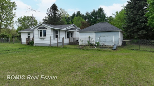 6128 Barnes Rd, Millington, MI 48746 - back of property with a garage and roof with shingles