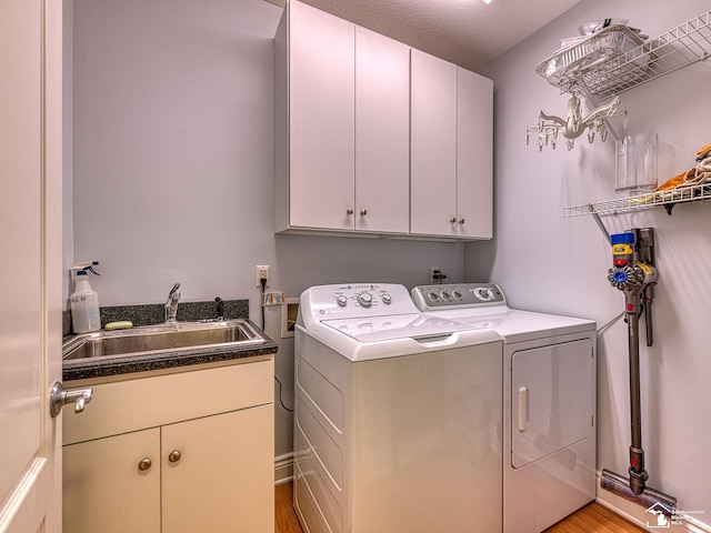 3159 Janea Rue Blvd, Monroe, MI 48162 - laundry room with cabinet space, separate washer and dryer, and light wood-type flooring