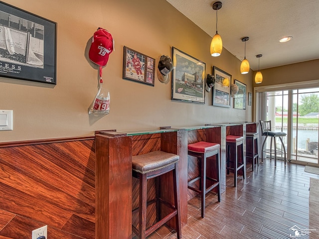 3159 Janea Rue Blvd, Monroe, MI 48162 - indoor dry bar featuring hanging light fixtures, a textured ceiling, recessed lighting, and wood finished floors