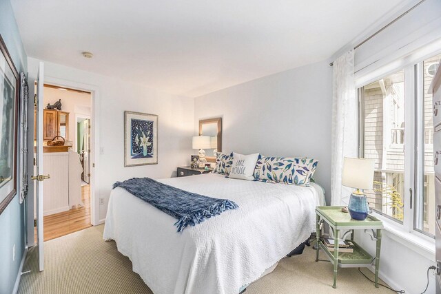 6180 Murray Rd Unit 301, Whitehall, MI 49461 - bedroom featuring light colored carpet and baseboards