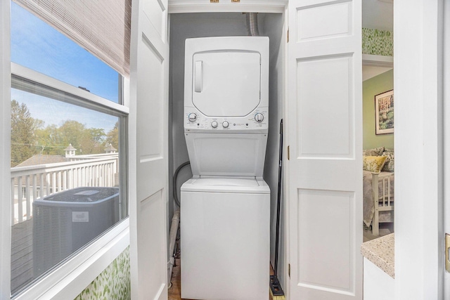 6180 Murray Rd Unit 301, Whitehall, MI 49461 - laundry area with stacked washer / dryer