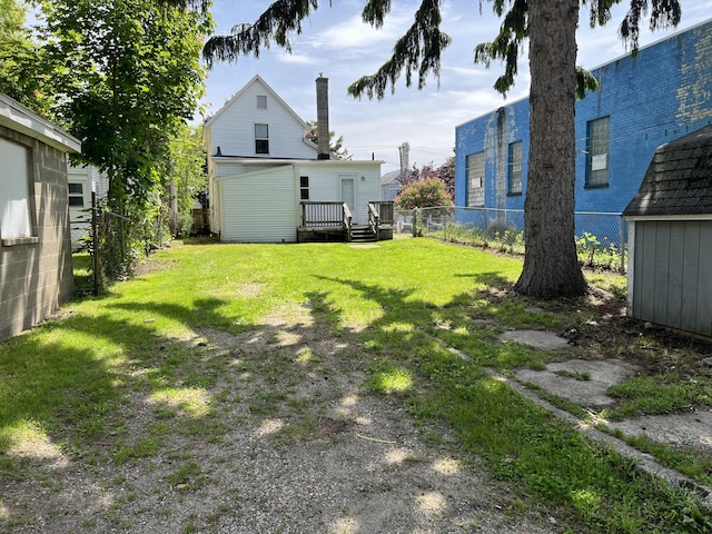 911 Muskegon Ave NW, Grand Rapids, MI 49504 - view of yard with an outbuilding and a deck