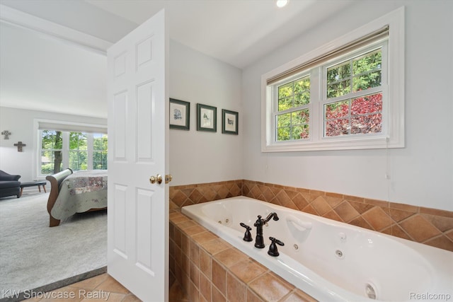 9120 Pineview Lake Dr, Linden, MI 48451 - full bathroom with ensuite bathroom, a tub with jets, and tile patterned floors