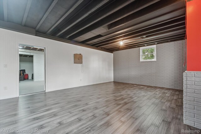 9120 Pineview Lake Dr, Linden, MI 48451 - below grade area featuring brick wall and wood finished floors