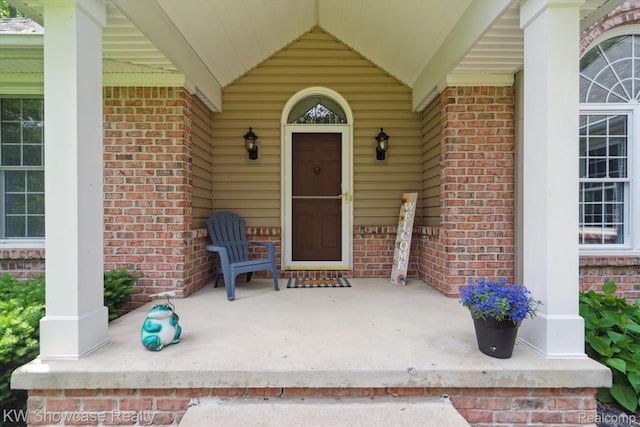 9120 Pineview Lake Dr, Linden, MI 48451 - view of exterior entry with brick siding and covered porch