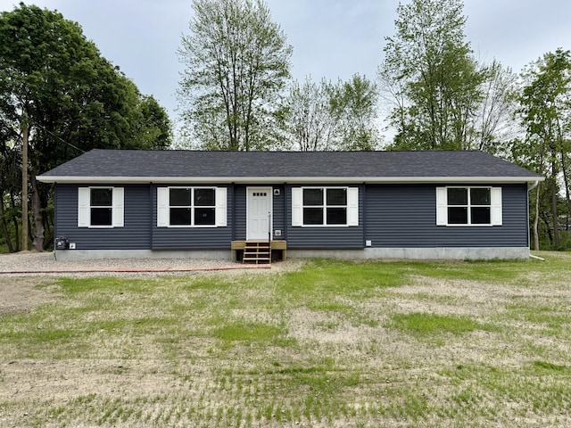 2827 Green Acres Dr, Mulliken, MI 48861 - view of front facade with entry steps, a front lawn, and a shingled roof